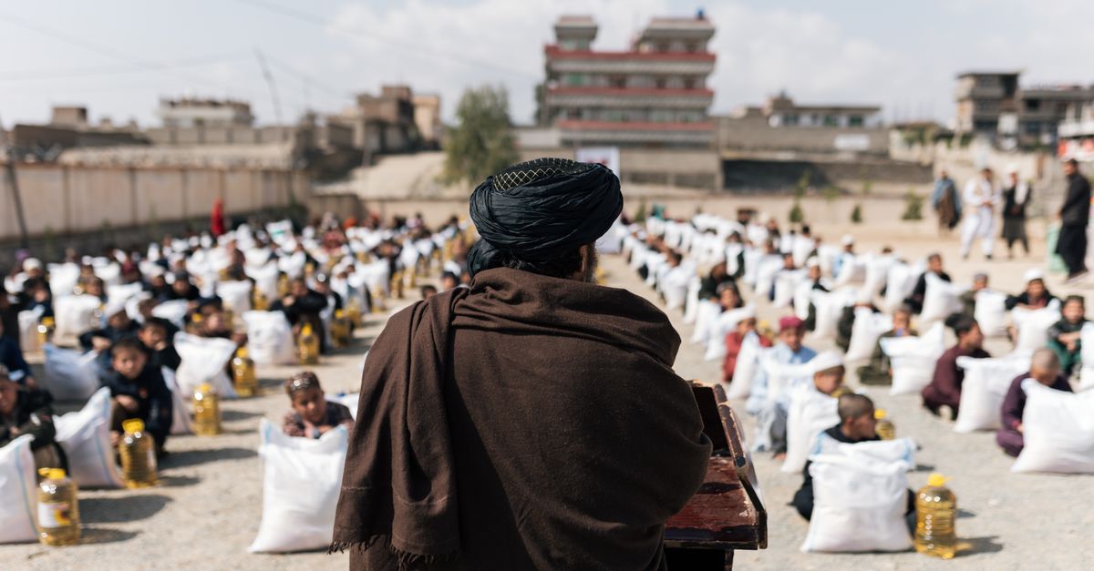 Crowd gathered for a humanitarian aid distribution event in Afghanistan.